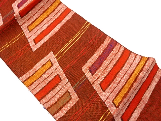 未使用品　手織り真綿抽象幾何学模様織出し名古屋帯（未仕立て）